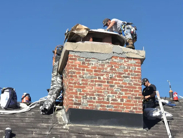 Fountain Valley Chimney Sweep installing a custom chimney crown in Fountain Valley, CA