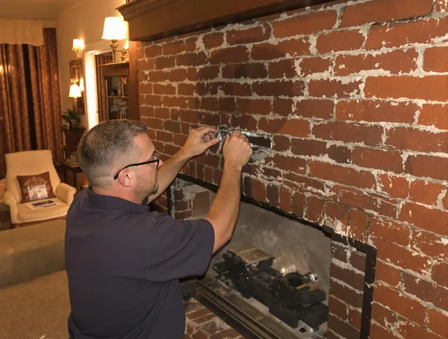 Fountain Valley Chimney Sweep expert fixing a fireplace in Fountain Valley, CA